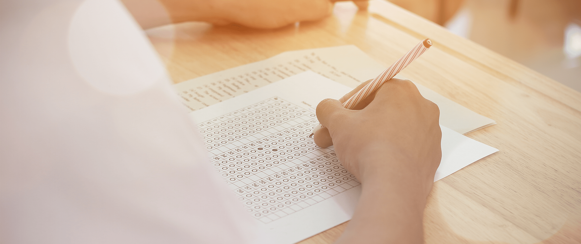 Closeup of student filling in a bubble on a test sheet
