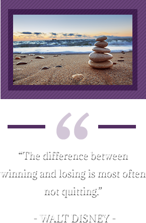 “The difference between winning and losing is most often not quitting.” – Walt Disney. Pebbles and sand on beach.