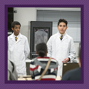 Two students in lab coats