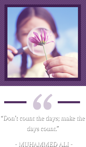 “Don’t count the days; make the days count.” – Muhammed Ali. Girl looking at flower through magnifying glass